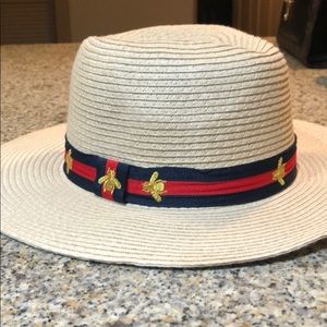 Vince Camuto with Red, gold and blue band.